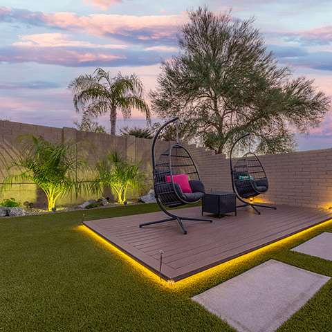 landscape-lighting grass surrounding seating area