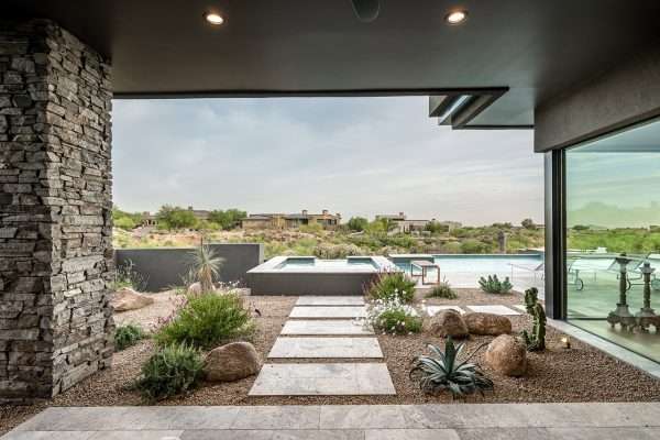 36867-N-101st-Way-8 drought tolerant plants next to walkway and pool